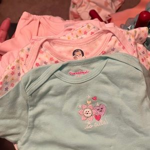 7 misc gowns;  2 are 0-3months; 5 are 0-6months